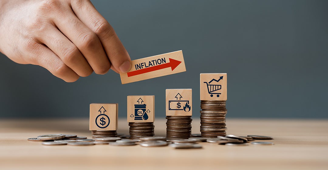 Image showing coins and a hand representing inflation