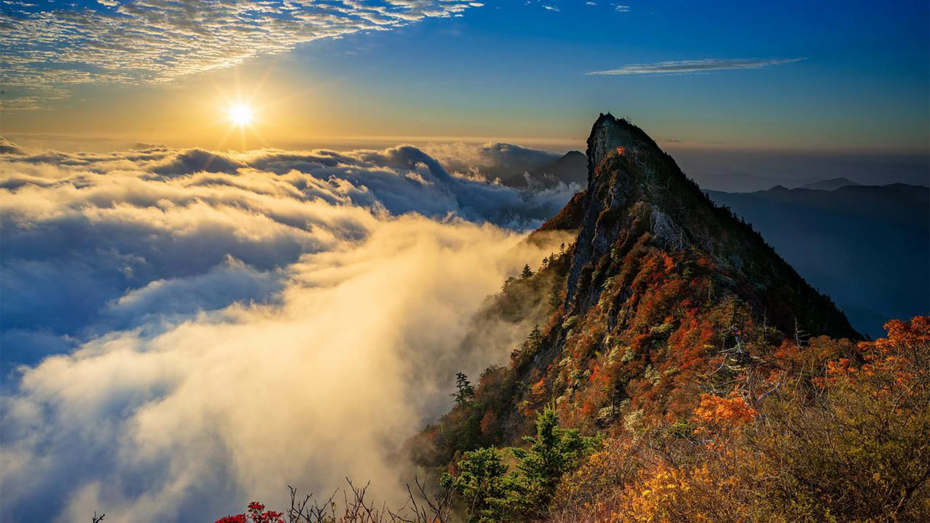 Image showing mountain into clouds with sunrise