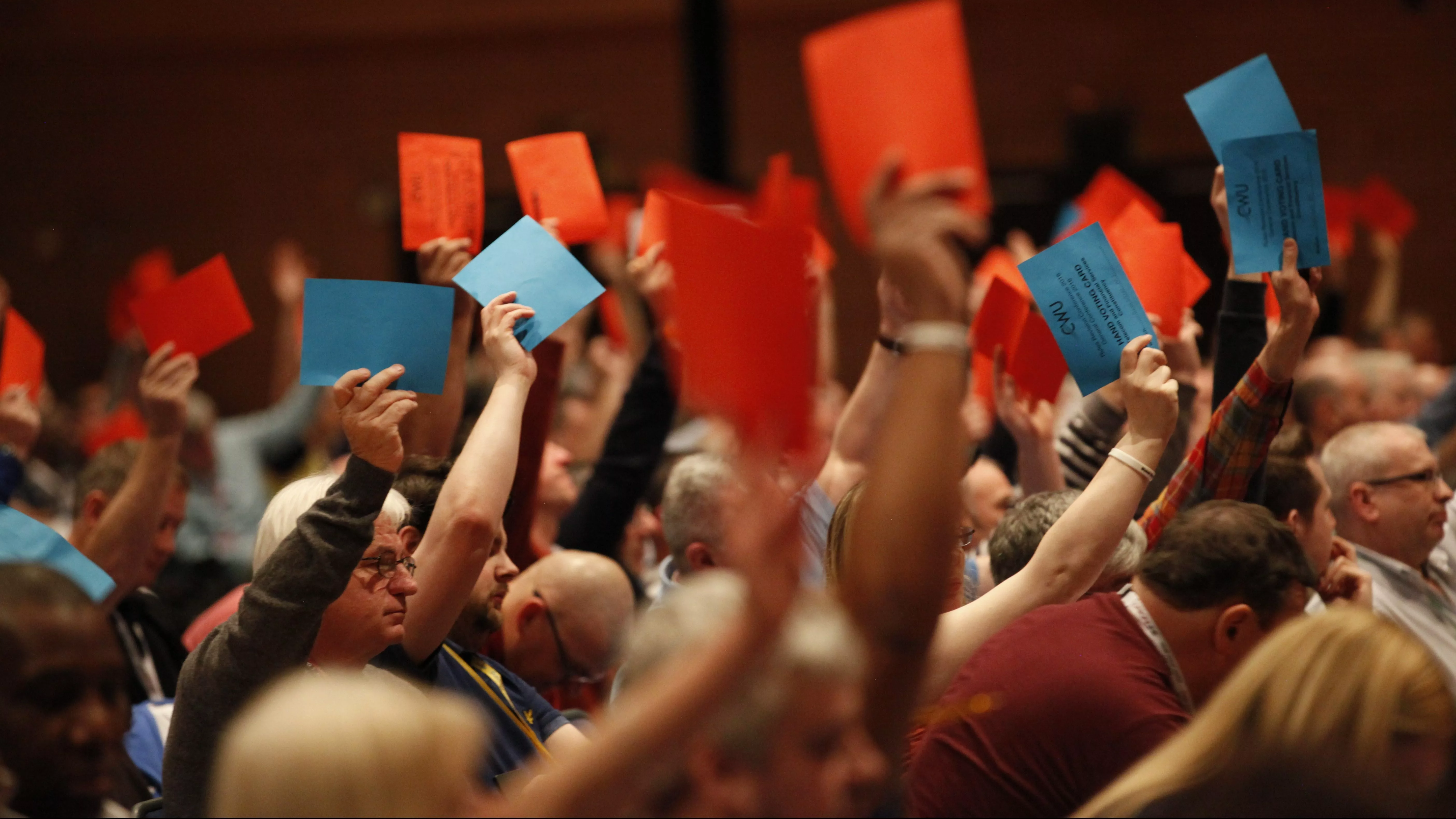 people hands up voting